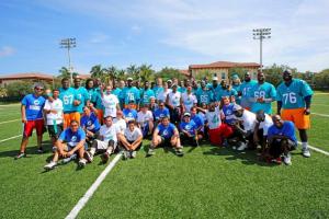 Miami Dolphins rookie class, General Manager Dennis Hickey and Special Olympics athletes group shot